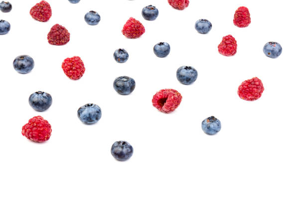 istock raspberries and blueberries isolated on white background 1270582583