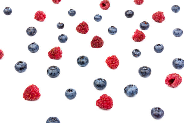 istock raspberries and blueberries isolated on white background 1270582617