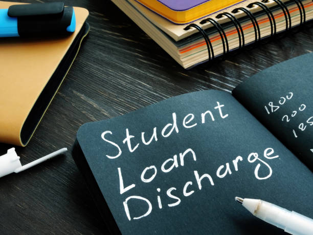 istock Student loan discharge memo on black page. 1270582797