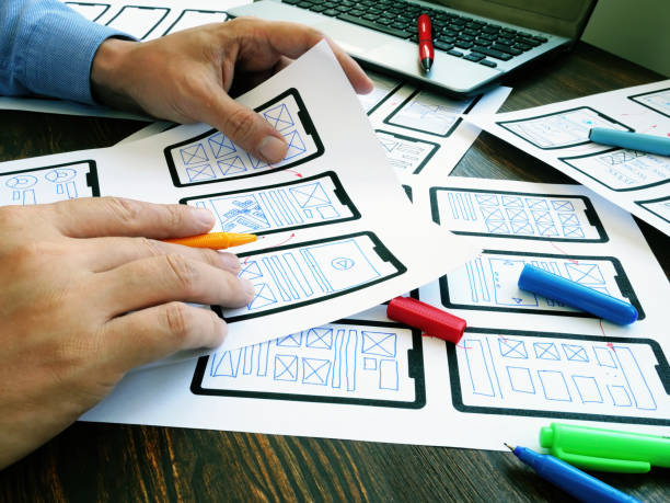 istock Ux ui designer working with web mobile app sketches. 1270582834