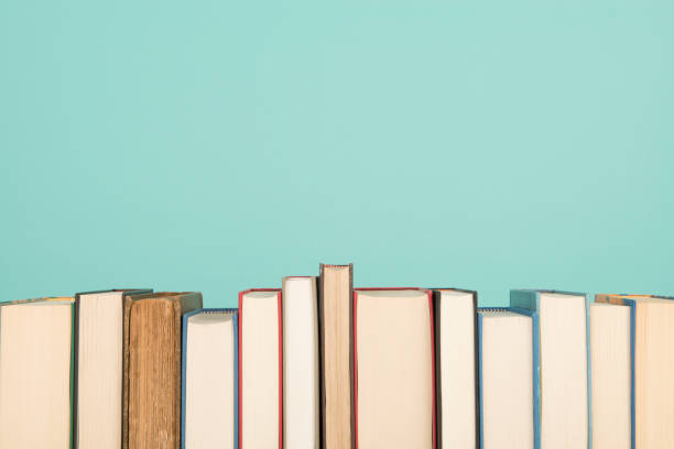 istock Row of books on a blue background 1270582886
