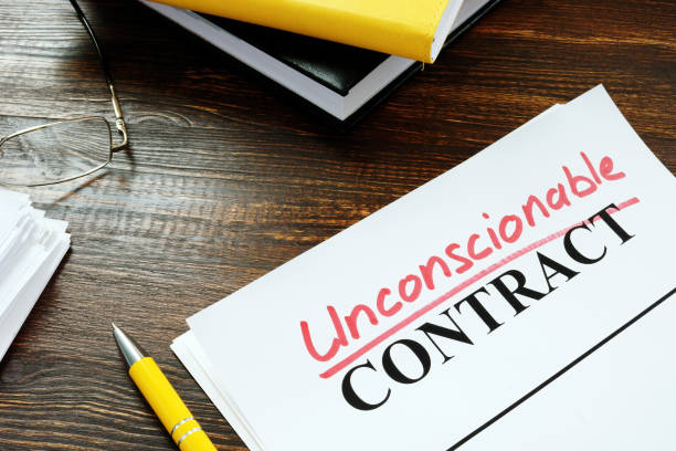 istock Contract with handwritten word unconscionable. 1270583162