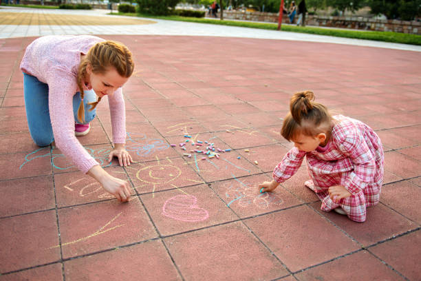 istock Single mother playing with her daughter in the park 1270583266