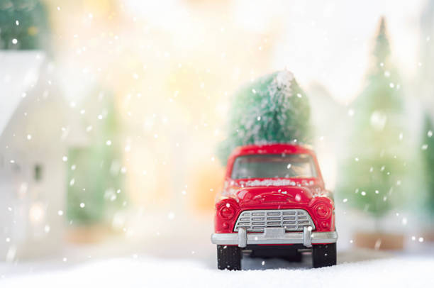 red car with a Christmas tree in the back