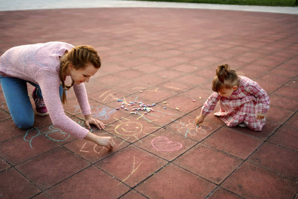 istock Single mother playing with her daughter in the park 1270584413