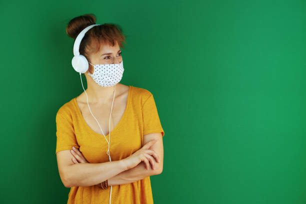 istock learner woman looking at copy space and listening to music 1270586537