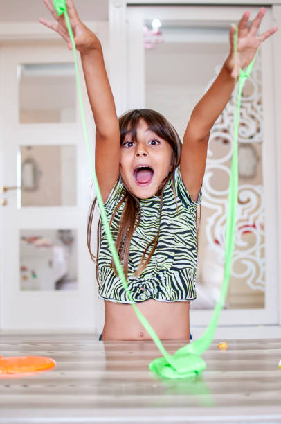 istock Cute girl plays with slime 1270590294