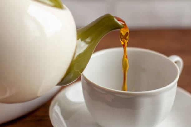 istock Fresh brewed black tea is poured into a Cup. 1270590738