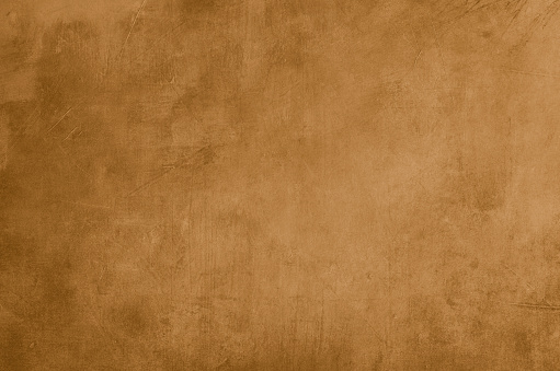 Ochre grungy wall backdrop or texture