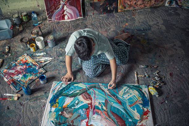 istock Boy painting in an art studio 1270593320