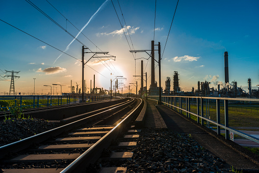 Railroad in industrial area near Rotterdam harbour. the Netherlands at sunrise.