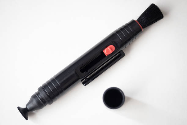 istock Pen for cleaning the front element of a camera lens 1270593435