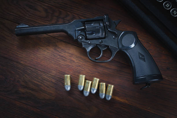 istock Retro vintage revolver gun with ammunitions 1270593456