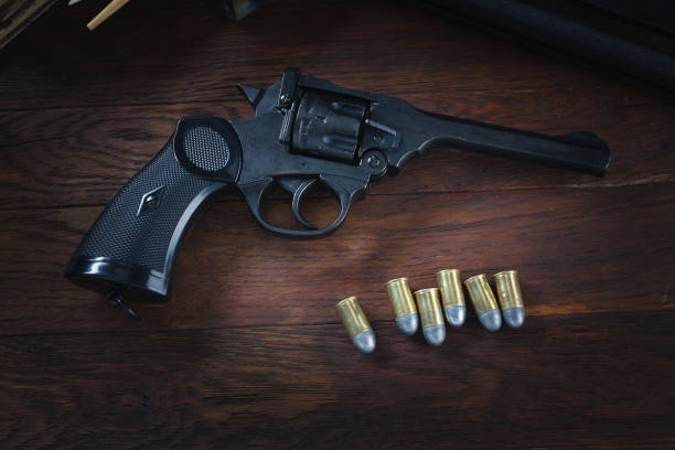 istock Retro vintage revolver gun with ammunitions 1270593512