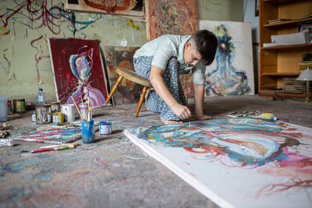 istock Boy painting in an art studio 1270593815