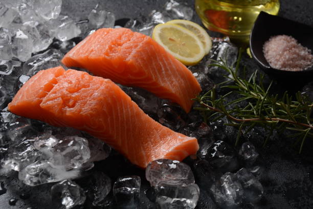 istock Raw salmon steaks on ice background 1270597079