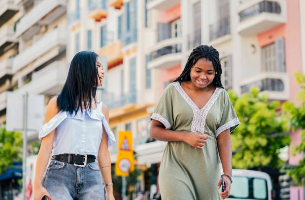 istock Friends walking through city, have fun 1270598161