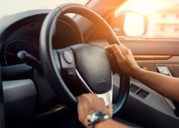 istock hand man wear watch and drive a car 1270602099