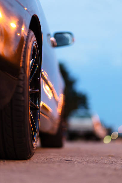 istock Car wheel at night park. 1270603036