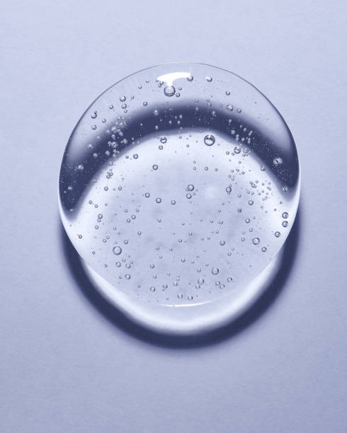 Single blob of transparent glycerin or gel. Glossy texture with tiny bubbles. Single drop or puddle. chemical formula photos stock pictures, royalty-free photos & images