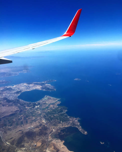 istock Sea and land view from airplane window 1270608084