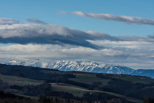 istock mountains with snow and sky with clouds 1270609837