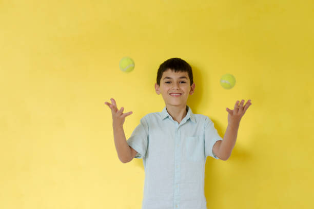 istock Boy with tennis balls 1270613002