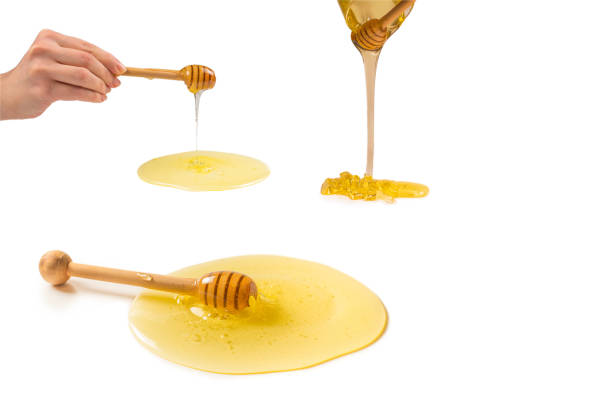 istock Dipper with honey on a white background. 1270614300