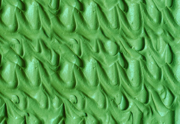 istock Green cosmetic clay (cucumber facial mask, avocado face cream, matcha body wrap) texture close up, selective focus. Abstract background with brush strokes. 1270614727