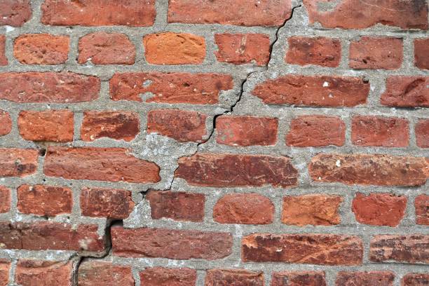 istock Old brick wall. Texture of old weathered brick wall panoramic background 1270615588
