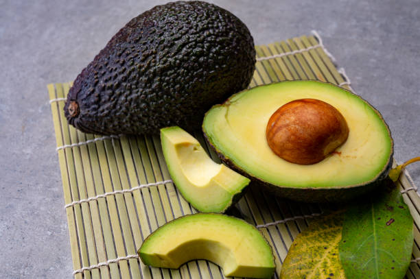 Healthy food, fresh ripe hass avocado from Peru Healthy food, fresh ripe hass avocado fruit from Peru hass avocado stock pictures, royalty-free photos & images