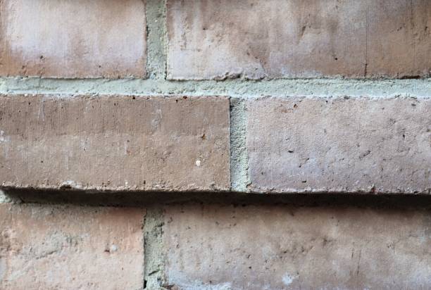 istock Old brick wall. Texture of old weathered brick wall panoramic background 1270615982