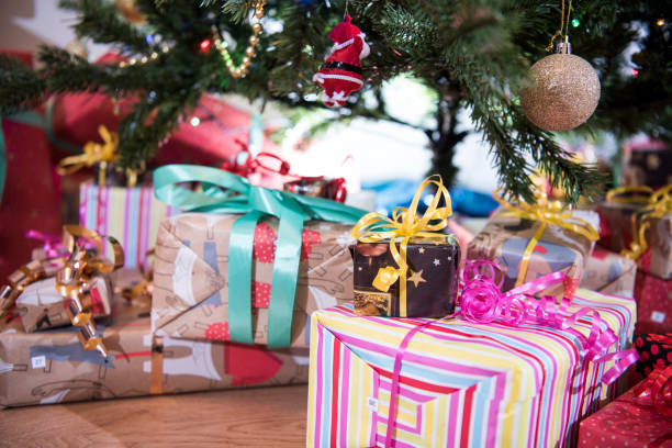 istock Gifts on the floor under the Christmas tree. 1270617346