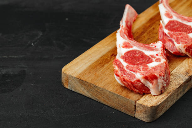 istock Racks of lamb ready for cooking on dark background 1270618380