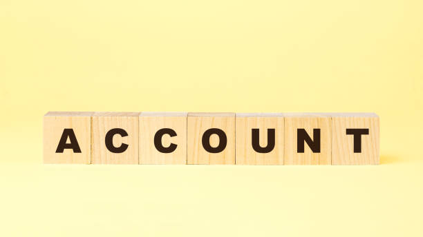 istock word account with small wooden blocks on yellow background 1270619657
