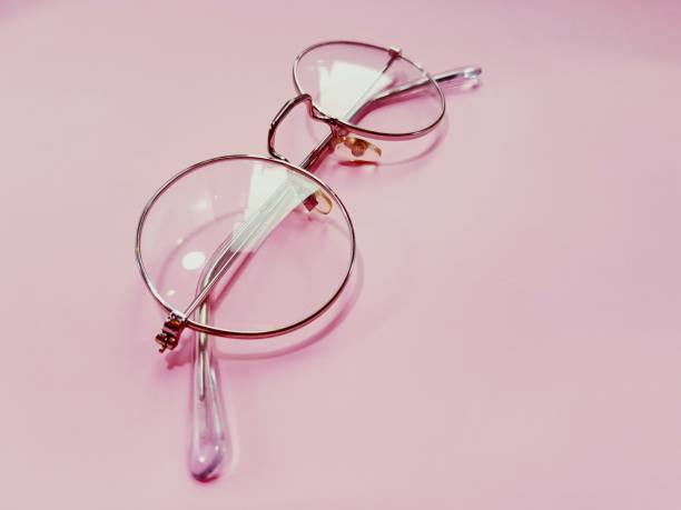 istock Transparent round glasses on a peach background. 1270620119