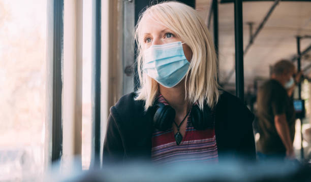 istock Wearing A  Protective Face Mask On Public Transport during COVID-19 1270620278