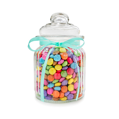 Chocolate candies in jar for wedding favours or colorful holiday decoration