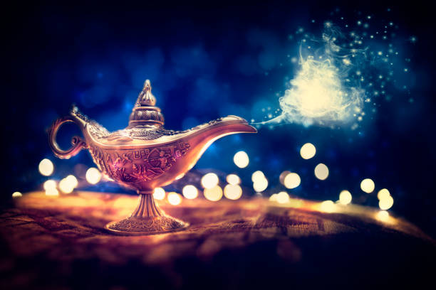 Magic Aladdins Genie lamp Magic lamp from the story of Aladdin with Genie appearing in blue smoke concept for wishing, luck and magic magician money stock pictures, royalty-free photos & images