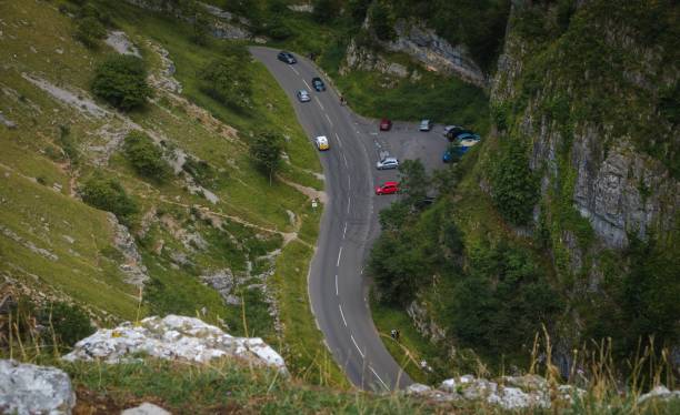 Cliffs of Cheddar Gorge from high viewpoint. High limestone cliffs in canyon in Mendip Hills in Somerset, England Cliffs of Cheddar Gorge from high viewpoint. High limestone cliffs in canyon in Mendip Hills in Somerset, England, UK cheddar gorge stock pictures, royalty-free photos & images