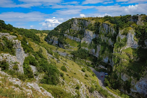 Cliffs of Cheddar Gorge from high viewpoint. High limestone cliffs in canyon in Mendip Hills in Somerset, England, UK