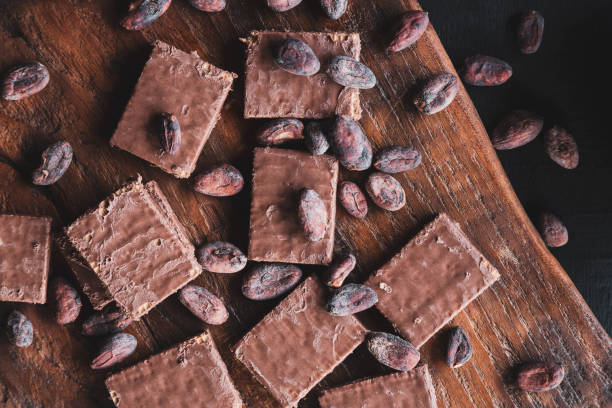 istock Chocolate and Cocoa Beans with Cocoa On a black background 1270623353