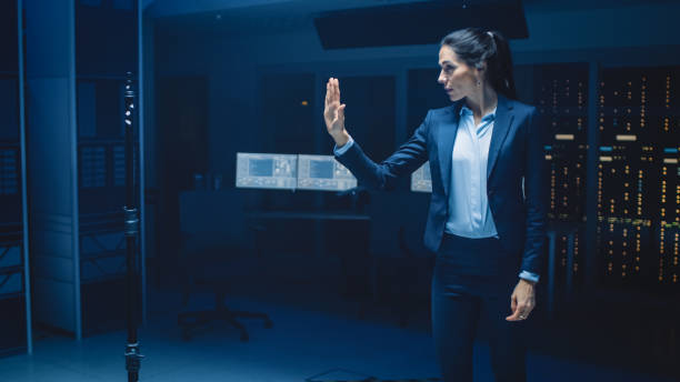 istock In Modern Data Center Research Laboratory Beautiful Confident Woman Does Virtual Reality Activating Touch Gesture. Mock-up Augmented Reality Shot. 1270623413