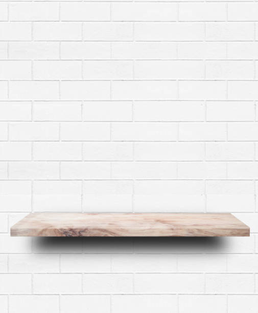istock Empty wooden shelf on white brick wall background. 1270624942