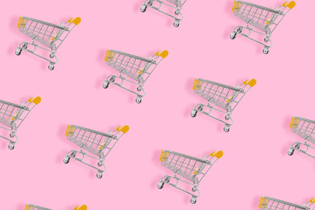 istock Shopping lover concept. Seamless pattern shopping cart on pink background. 1270627063