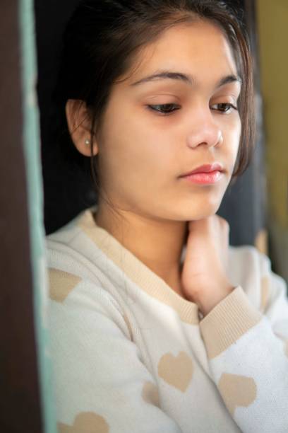 istock Portrait of sad, serene young girl thinking with blank expression. 1270628244