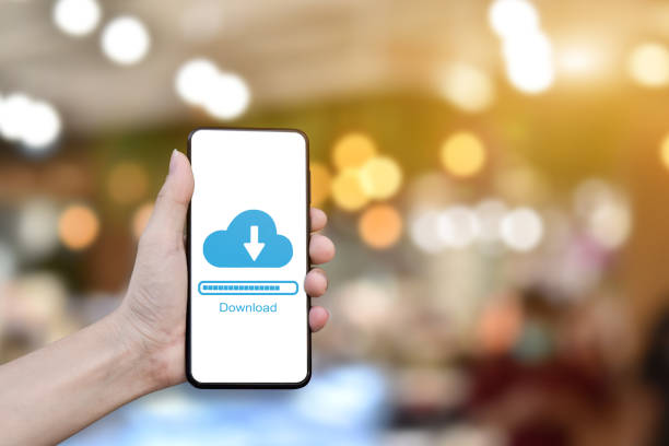 istock Businessman hand using mobile phone with cloud download form stored data. 1270628699
