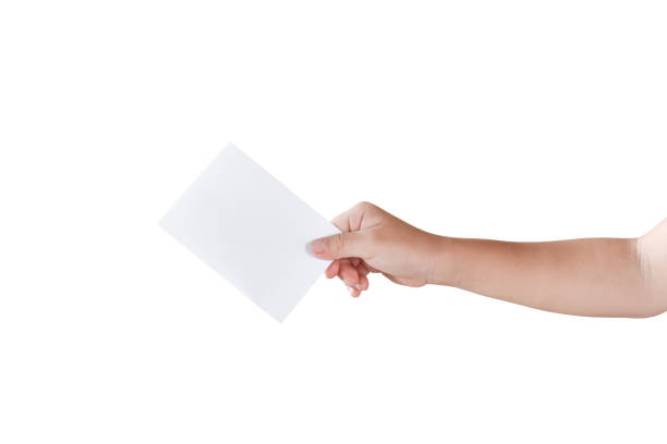 Child hand holding business card ( white paper card ) Isolated on white background stock photo