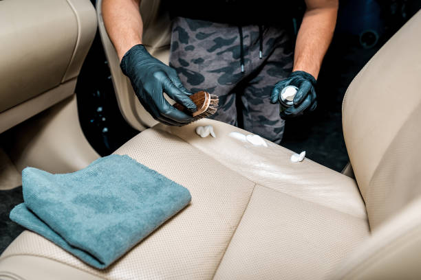 istock specialist cleans the car seat with a special foam 1270629970