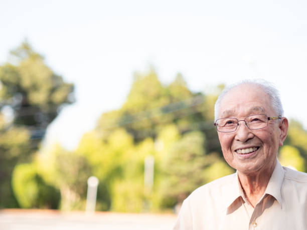 istock An elderly Asian man smiling happily outside 1270630211